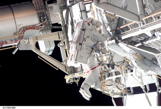 Forrester works at the S3/S4 Trusses during EVA 2 on STS-117 Mission