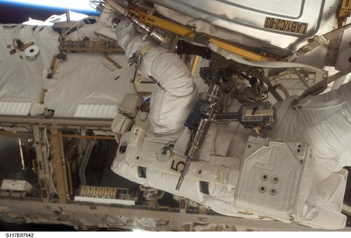 Reilly installs a water to hydrogen vent on the outside of the U.S. Laboratory during EVA 3
