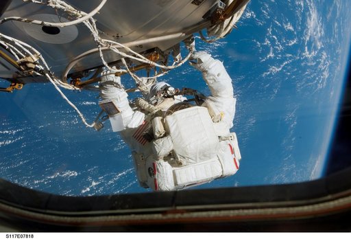 Forrester moves to the Quest A/L during Extravehicular Activity 4