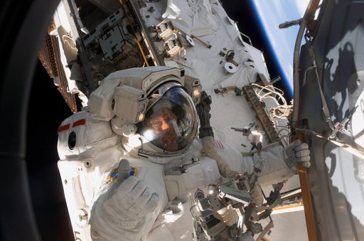 Forrester moves to the Quest A/L during Extravehicular Activity 4