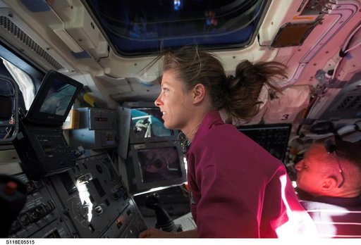 View of Caldwell working in the FD during STS-118