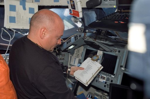 View of Kelly working in the FD during STS-118