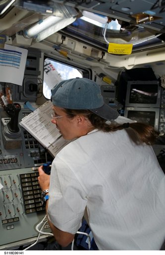 View of Caldwell working the SRMS during STS-118/Expedition 15 Joint Operations