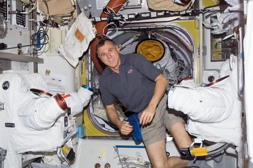 View of MS Williams posing with EMUs in the A/L during STS-118