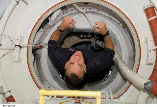 Hobaugh posing for a photo during STS-118/Expedition 15 Joint Operations