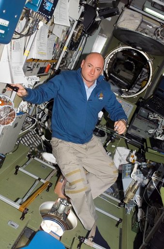 View of Kelly posing for a photo in the SM during STS-118