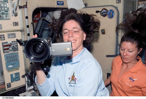 View of Crewmembers in the SM during STS-118/Expedition 15 Joint Operations