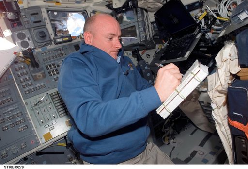 View of CDR Kelly working in the FD of the Shuttle Endeavour during STS-118