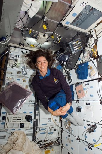 View of STS-118 MS Morgan posing with Basil Seeds in the MDDK of the Shuttle Endeavour