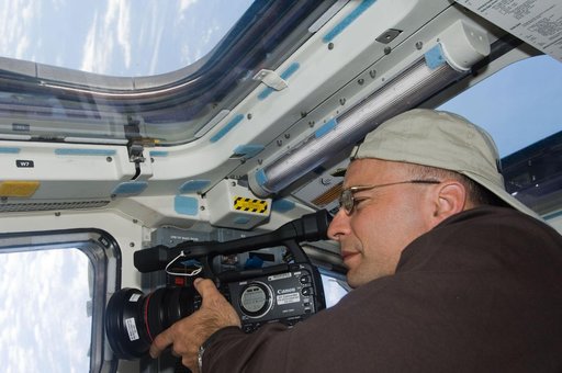 Archambault with video camera on Flight Deck (FD)