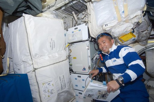 Wakata near General Laboratory Active Cryogenic ISS (Glacier) rack on Middeck (MDDK)