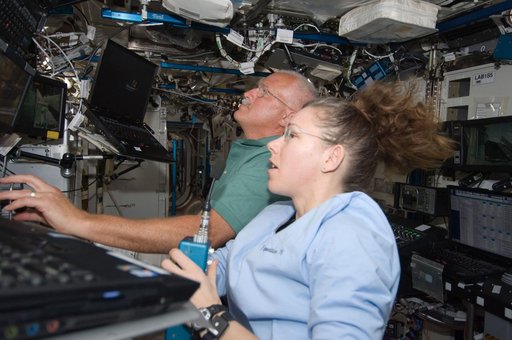 Crew at Robotics Workstation (RWS) for SSRMS OPS