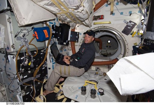 Swanson at Laptop on Middeck (MDDK)
