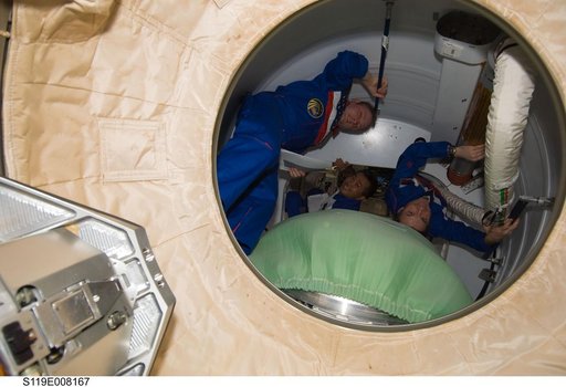 Crew in Shuttle Airlock conduct Undocking Prep