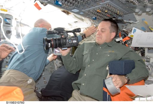 Arnold with video camera on Flight Deck (FD)