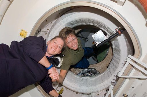 Whitson greets Melroy after docking