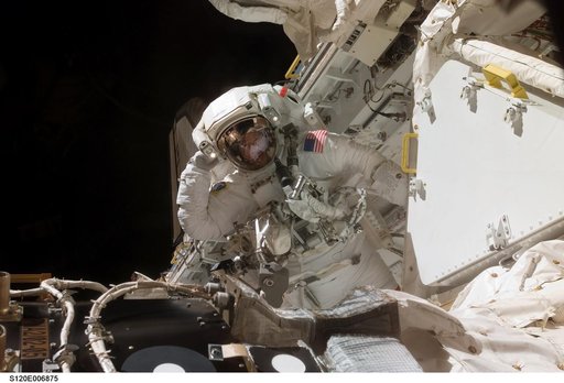 EVA 1 - Parazynski in Discovery payload bay
