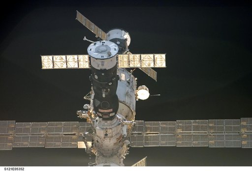 Soyuz,FGB and the SM as Discovery approaches for docking during STS-121