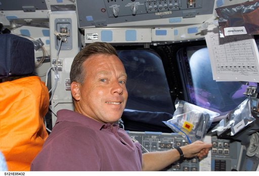 Lindsey sits in the CDR seat in the FD during STS-121