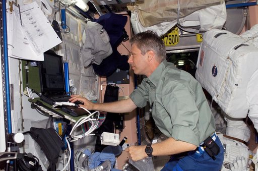 Reiter uses a computer in the Node 1 module during STS-121/Exp. 13 OPS