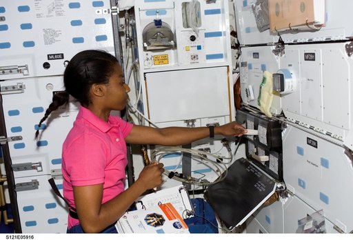 Wilson pulls out a MDK locker drawer during STS-121/ Exp. 13 joint OPS