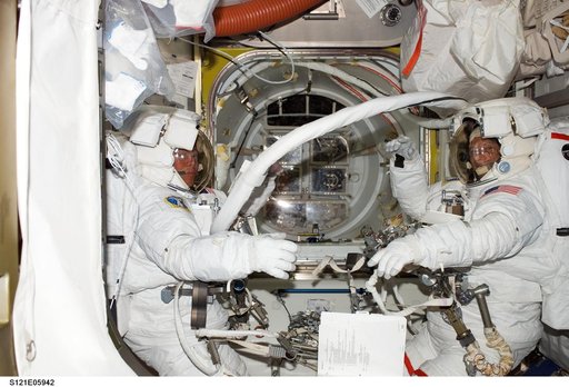 Sellers and Fossum in EMUs inside the A/L before their EVA1 during STS-121 / Exp. 13 joint OPS