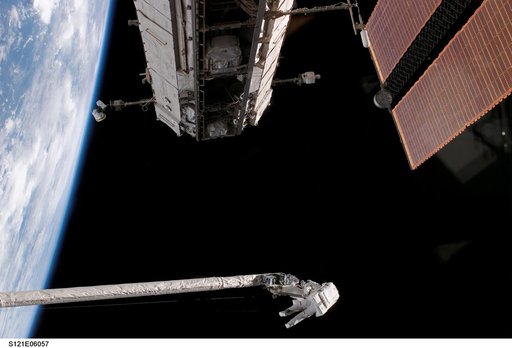 Fossum and Sellers on the OBSS during EVA1 on STS-121 / Expedition 13 joint operations