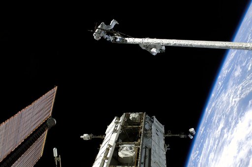 Fossum and Sellers on the OBSS during EVA1 on STS-121 / Expedition 13 joint operations