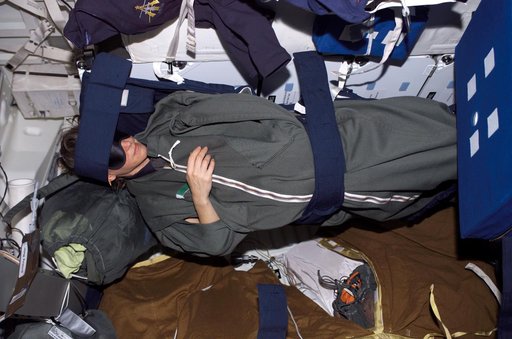 Nowak in sleeping bag on the MDK during STS-121 / Expedition 13 joint operations