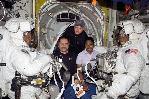 Group photo of Exp. 13 and STS-121 crew members during EVA2 prep on STS-121 / Expedition 13 joint operations