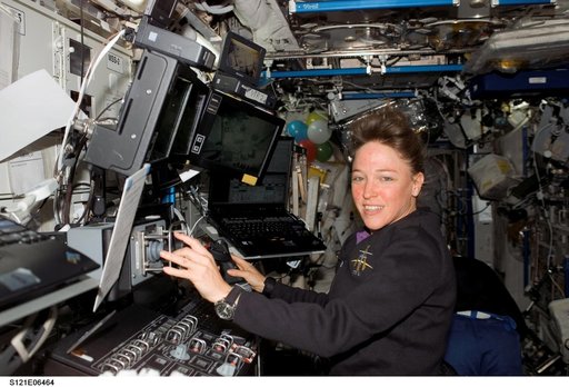Nowak works at the SSRMS during DTO 848 OPS on EVA3 during STS-121 / Expedition 13 joint operations