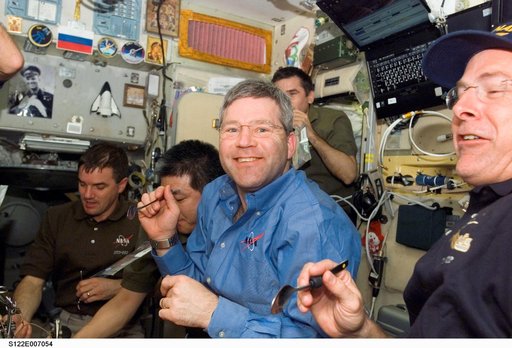 Crewmembers share a meal in the SM