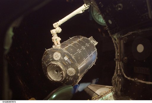 Columbus being moved into installation position by the SSRMS