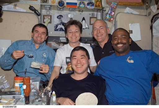 Crewmembers share a meal in SM