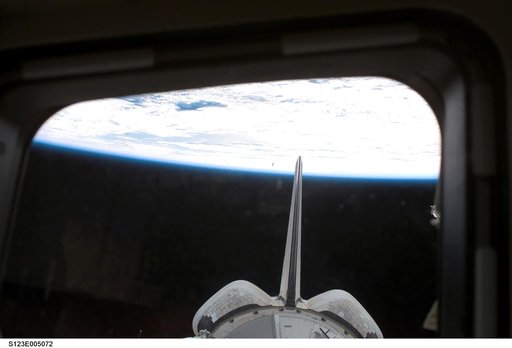 Vertical Stabilizer and OMS pods from the aft FD window during STS-123 mission