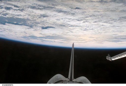 Vertical Stabilizer and OMS pods from the aft FD window during STS-123 mission