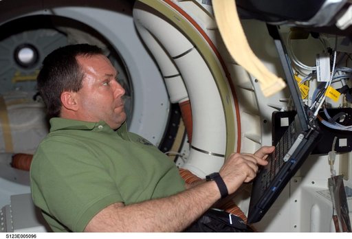Foreman uses computer in the MDDK during STS-123 mission