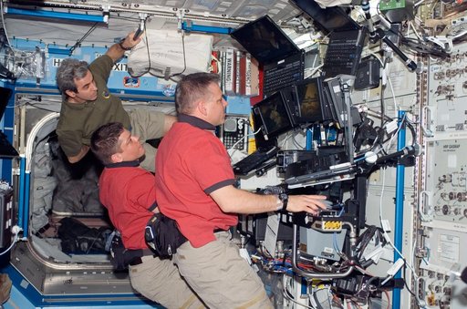 STS-123 Crewmembers work in the U.S. Laboratory/Destiny
