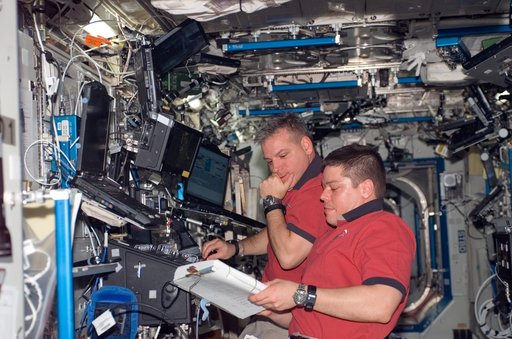 STS-123 Crewmembers work in the U.S. Laboratory/Destiny