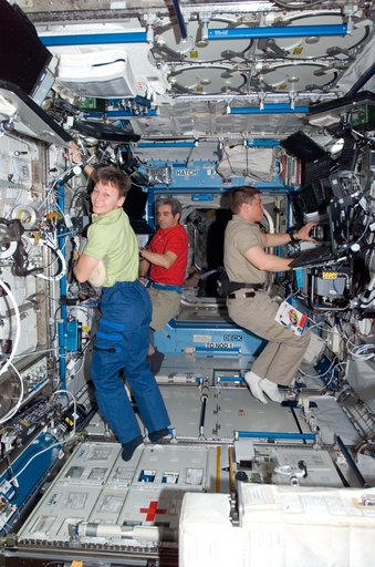 STS-123 Crewmembers work in the U.S. Laboratory during STS-123 / Expedition 16 Joint Operations