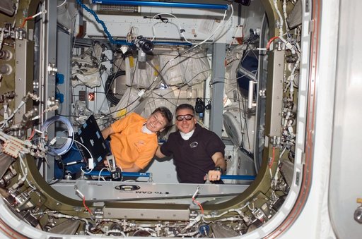 Whitson and Johnson in the Node 2 hatch during STS-123 / Expedition 16 Joint Operations