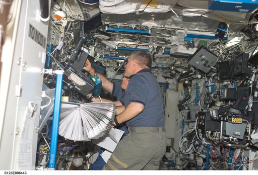 Johnson works the controls of Robotic Canadarm2 in the U.S. Laboratory during Joint Operations