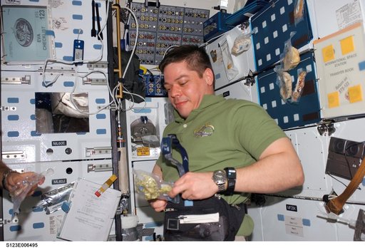 Behnken open food package in the MDDK on Space Shuttle Endeavour