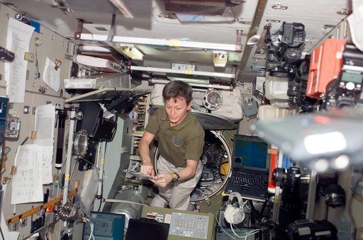 Whitson looks over crew procedures in the SM during Joint Operations