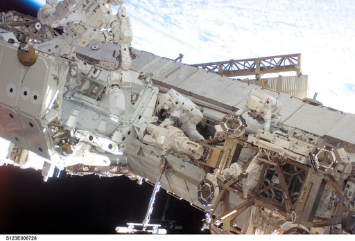 Linnehan and Behnken work on the Dextre on EVA 3 during Expedition 16 / STS-123 Joint Operations