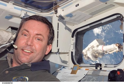 Foreman in the aft FD window during Expedition 16 / STS-123 Joint Operations
