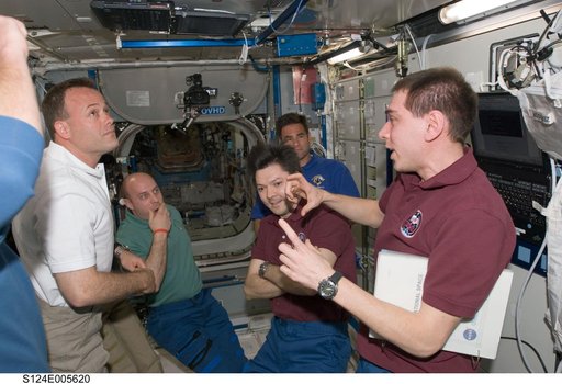 STS-124 and Expedition 17 crew greet after docking