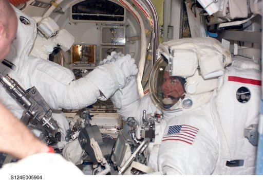 Garan and Fossum in airlock prior to EVA 1