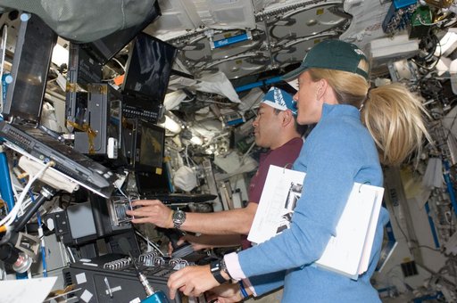Nyberg and Hoshide in U.S. Lab during Kibo installation during EVA 1