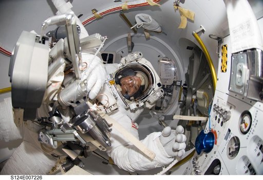 Preparing for EVA 3 in Quest airlock